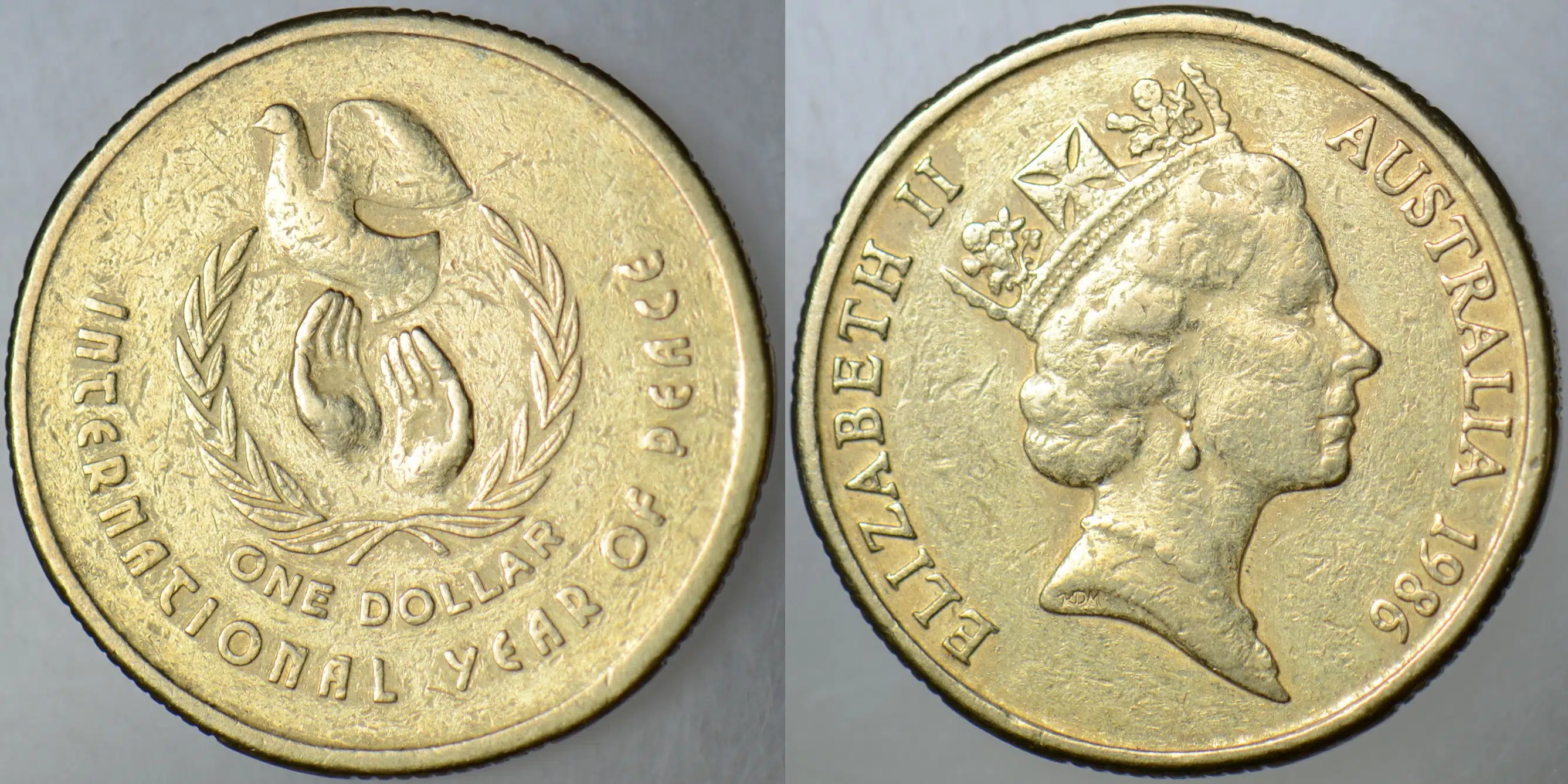 AVUSTRALYA 1 DOLAR 1986 SİRKÜLASYON HATIRA-ULUSLARARASI BARIŞ YILI. KRALİÇE II. ELİZABETH.