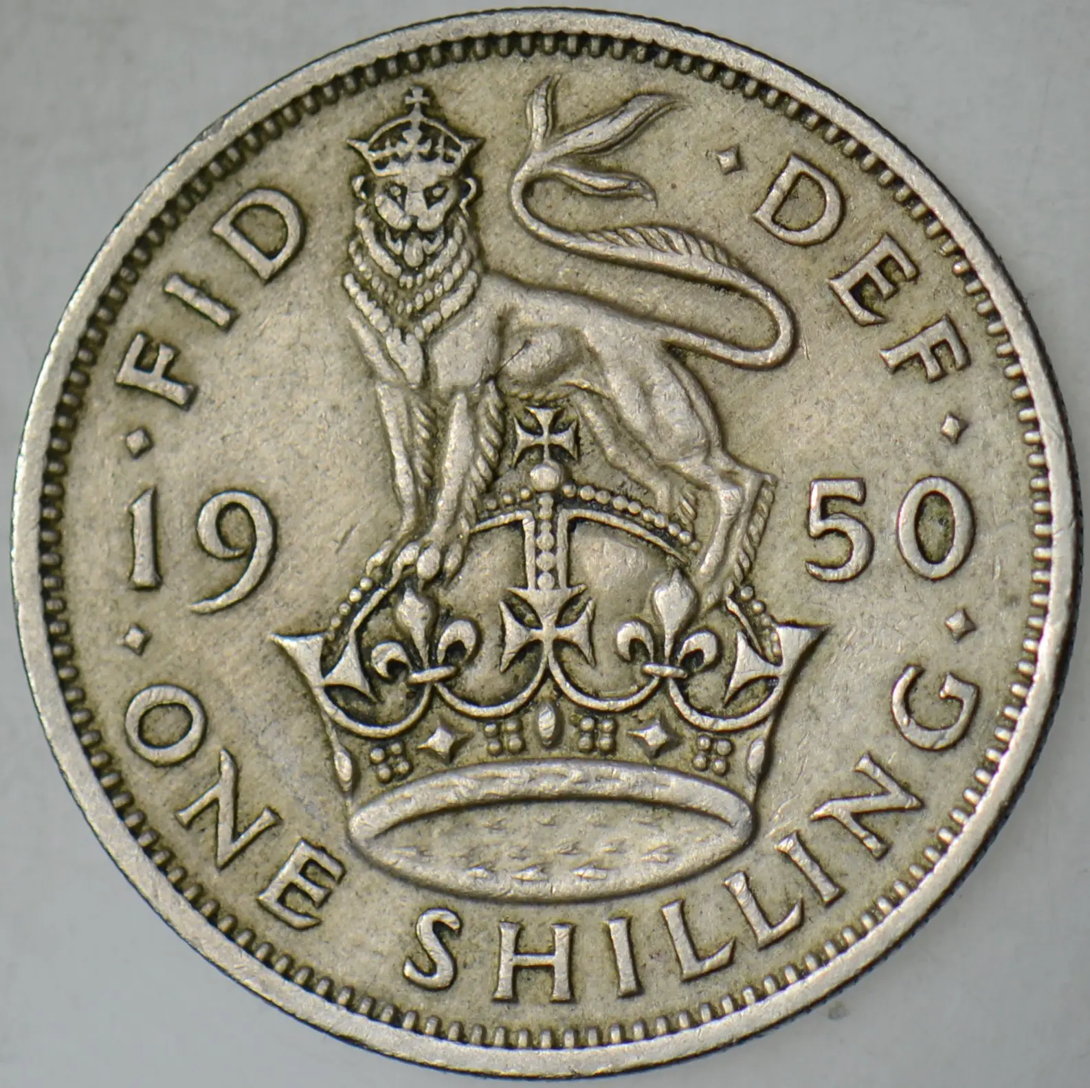 BİRLEŞİK KRALLIK 1 ŞİLİN 1950 KRAL 6. GEORGE (KRALİÇE II. ELİZABETH'İN BABASI). İNGİLTERE. 23,5 mm.